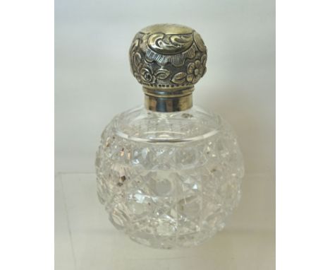 A small cut glass globe Scent Flask with embossed silver cover, London, 1897, maker Mappin & Webb.