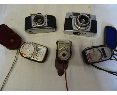 An Agfa Karat vintage Camera circa 1948 an Agfa Agnar camera and three light meters. 