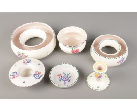 A quantity of Poole pottery including candlestick holder and small bowls.  