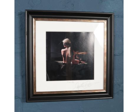 A Dutch print of young woman playing piano blindfolded. Titled "Pianiste" and signed by photographer.  