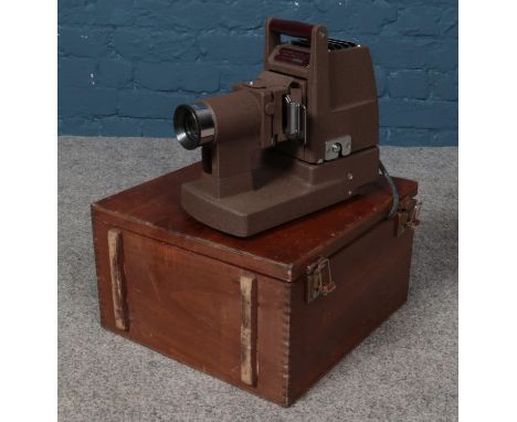 A Kershaw Model 250 slide projector in original wooden case with instructions.  