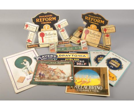 A collection of vintage tobacco and cigarette related display stands.  