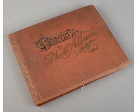 A vintage Ogden's Photo Album with contents of cigarette cards. Includes Chairman Old Pottery &amp; Porcelain, Ogden's, Lambe