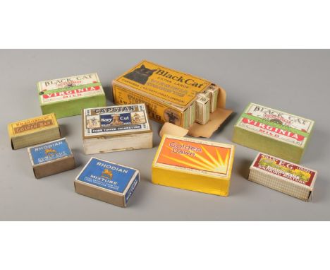 A quantity of vintage dummy cigarette and tobacco packets. Includes Black Cat, Capstan, Rhodian etc.  