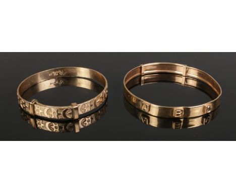A 9ct Gold Christening bangle, together with a similar 9ct Rolled Gold example. Weight of 9ct example: 2.35g  