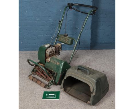 A Atco Commodore B14 lawnmower with manual.  