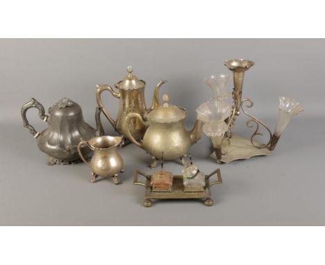 A quantity of assorted metal wares including pewter tea pot, silverplated coffee pot and candlestick holder.  