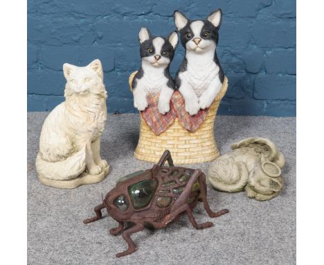 A collection of garden ornaments; including composite cat doorstop/stick stand, concrete cat features and beetle tea-light ho