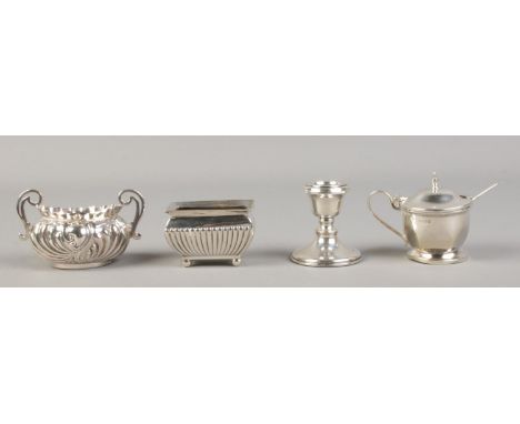 A collection of table silver. To include mustard pot with blue glass liner and spoon, two silver salts (missing liners) and f