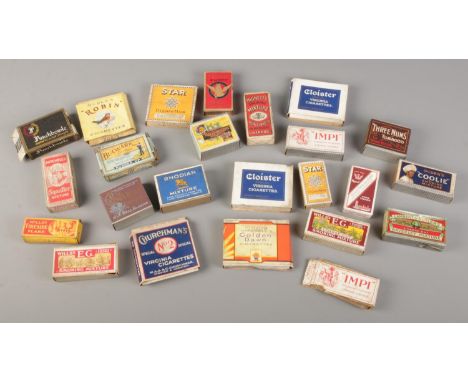 A collection of vintage dummy cigarette and tobacco packets.  