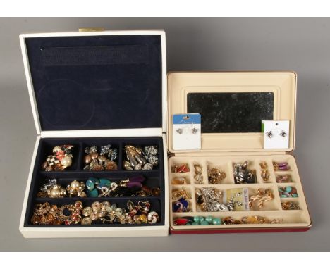 Two large boxes of vintage earrings contained withing jewellery boxes.  