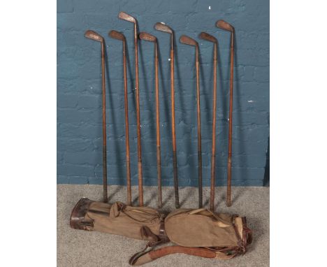 A quantity of vintage golf clubs. Including W H Wooler, etc.  