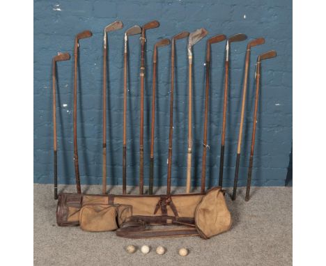 A quantity of vintage golf clubs. Including Thistle,  Tom Gillies, Maxwell Mashie, Halley putter, Spalding, etc.  