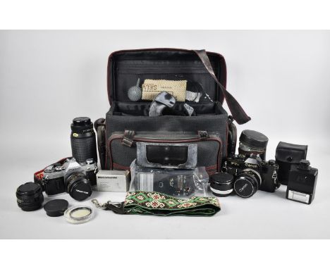Two Vintage 35mm Cameras, Canon FTb and Canon AE-1 together with Various Telescopic and Other Lenses, Light Gun and Accessori