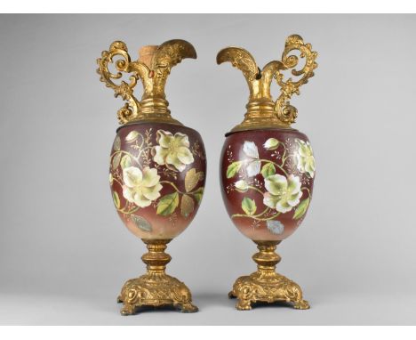A Pair of Continental Ceramic and Gilt Metal Ornamental Ewers, 47cms High 