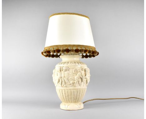 A Continental Relief Decorated Table Lamp, With Shade 