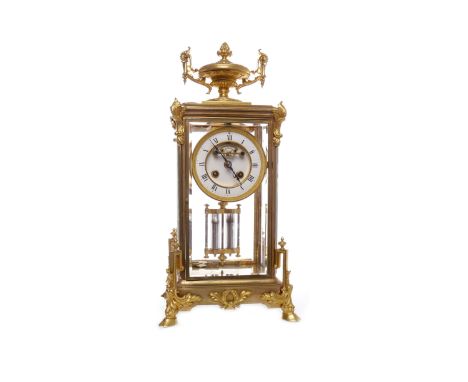 ATTRACTIVE 19TH CENTURY FOUR GLASS MANTEL CLOCKthe giltmetal case with tasselled double handled urn cresting, with circular w