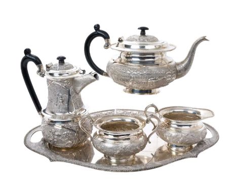 20th century Indian silver four piece teaset, comprising teapot of compressed baluster form, with embossed decoration of rura