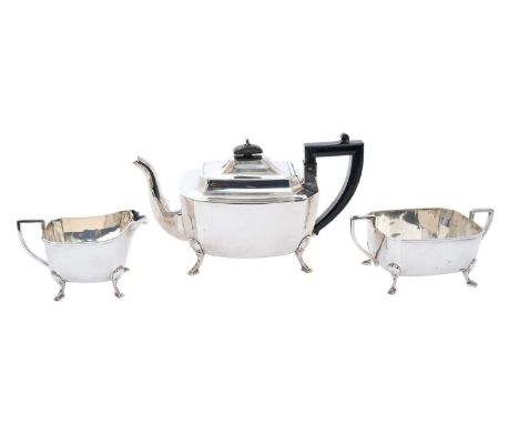 1930s silver, Art Deco style, three-piece tea set, comprising teapot of faceted form, with hinged domed cover and composite a