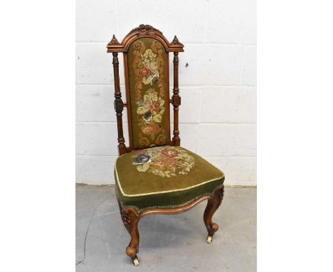 Victorian walnut and tapestry side chair, raised on cabriole legs and castors