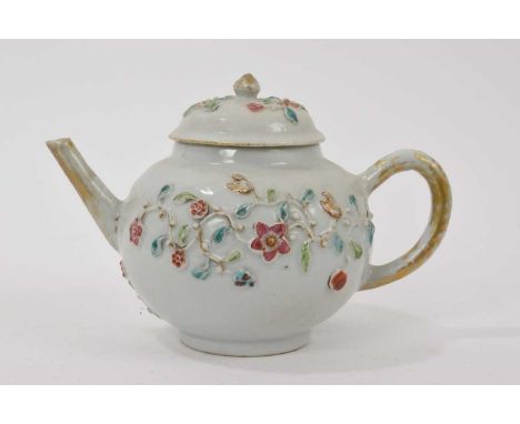 18th century Chinese export porcelain teapot and cover, with moulded and polychrome painted floral decoration, 20cm from spou