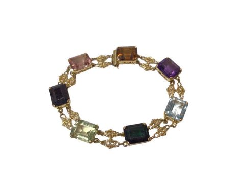 Gold and multi-gem bracelet with rectangular step cut gem-stones to include pink and green tourmalines, amethyst, garnet and 