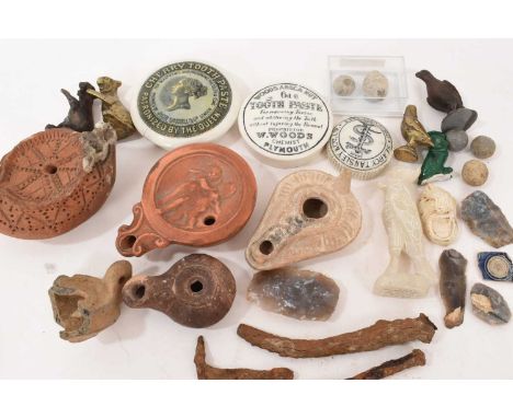 Collection of antiquities and curios including Roman and reproduction terracotta oil lamps, Victorian pot lids, Roman bronze 