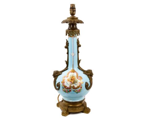 French Sèvres style metal mounted porcelain table lamp, of bottle form with mask and scroll ornament and decorative reserves,