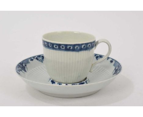 Worcester ribbed coffee cup and a trembleuse saucer, circa 1760, decorated in blue with patterned borders, the saucer 13cm di