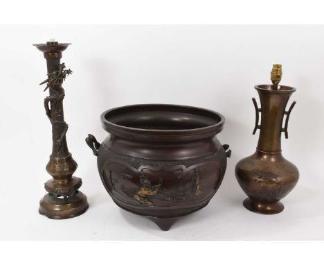 Large Japanese bronze jardinière, 74cm wide, together with a Japanese bronze twin handled vase, and similar candlestick. (3)