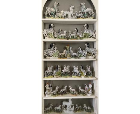 Extensive collection of Staffordshire zebras, predominantly 19th century, of various shapes and sizes (35)Several with some r