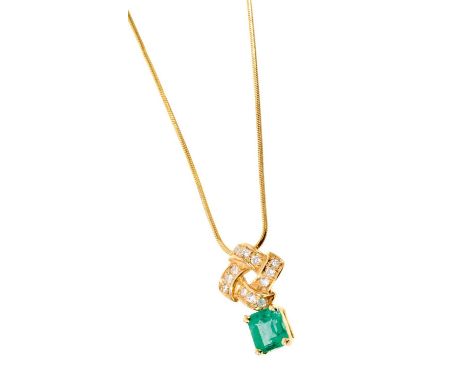 Emerald and diamond pendant with a rectangular step cut emerald measuring approximately 6.4 x 5.7 x 4.7mm suspended from a di