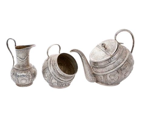 Late 19th/early 20th century Indian Kang - type, three piece, silver tilted tea service, comprising teapot of globular form, 