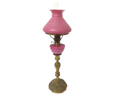 19th century peg lamp with pink glass shade and reservoir on ormolu candlestick base, total height 55cm