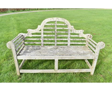Lutyens style teak garden bench, approximately 166cm wideSlats missing to the right arm, some other timber losses, splits to 