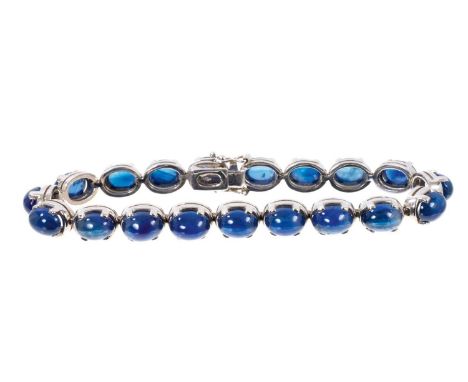 Cabochon blue sapphire and 18ct white gold bracelet with nineteen blue sapphire oval cabochons measuring approximately 8 x 6m