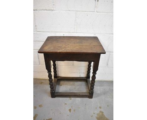 Late 17th century oak side table, with end frieze drawer on bobbin turned legs united by stretchers, 56cm wide x 39cm deep x 