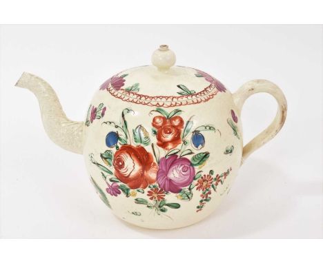Creamware globular teapot and cover, circa 1770, polychrome painted with flowers, 21cm from spout to handle