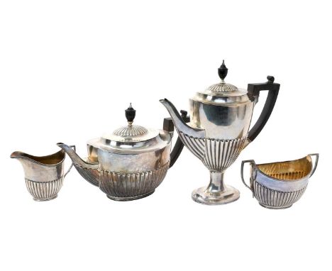 Edwardian silver four piece tea and coffee set, comprising teapot of half fluted form, with hinged domed cover and angular eb