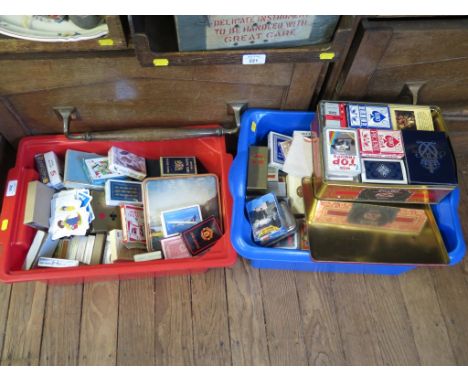 A collection of playing cards, some sealed, some with special faces