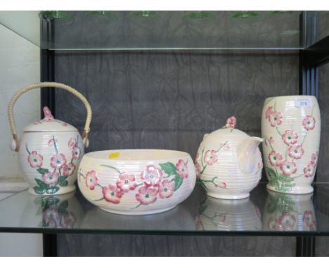 A Maling lustreware teapot with pink floral decoration, 17cm high, a matching biscuit caddy, fruit bowl and vase