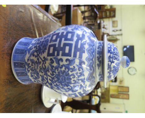 A modern Chinese blue and white baluster vase and cover, with monogram and foliate floral scroll decoration, import marks 31c