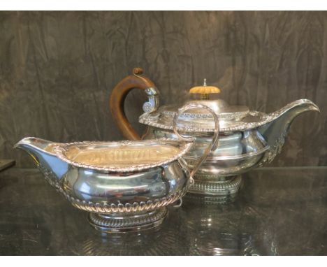 A late George III silver tea pot by Paul Storr, of rectangular form with shell and gadrooned border and anthemion spout, on a