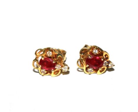 A pair of ruby and diamond earrings