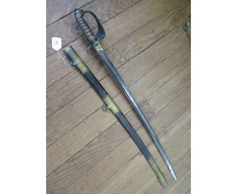 A 19th century coastguard officer's sword, the guard monogrammed C.G. with etched blade and leather scabbard, length of blade