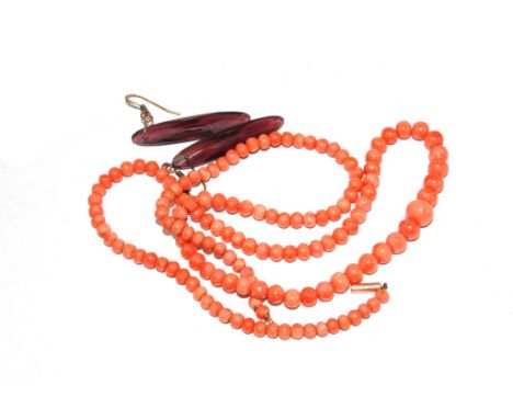 A string of fine colour coral beads and a pair of faux amethyst earrings