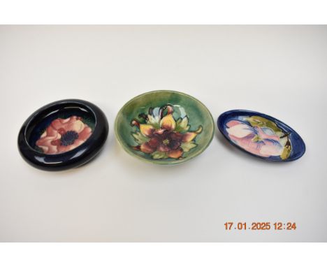 Three pieces of Moorcroft, Aquilegia shallow bowl, 11.5cm diameter, Anemone folded edge dish, 11.5cm diameter and a Magnolia 