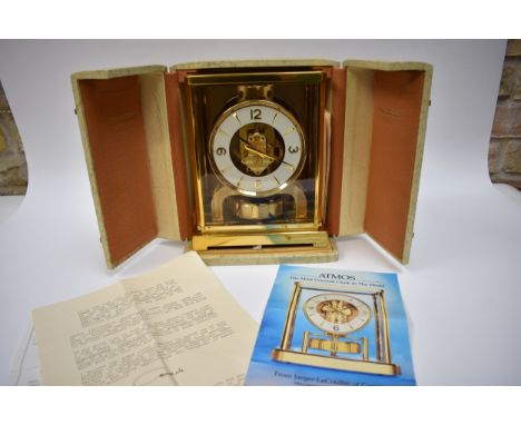 A Jaeger-LeCoultre Atmos brass cased mantel clock, the white chapter ring with Arabic numeral and arrow head markers, glass p