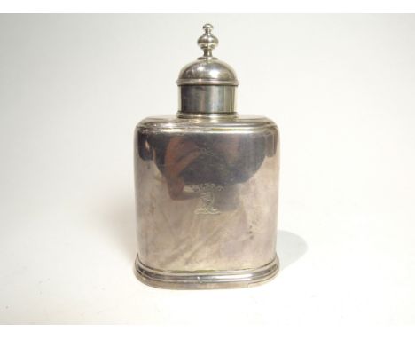 A George II silver tea caddy with removeable domed cap and a sliding base. The body with dog's crest and motto "Spero" (Hope 