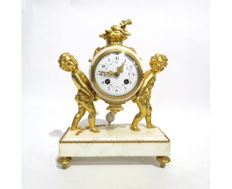 A 19th Century Louis XVI style white marble and ormolu/gilt metal mantel clock, the marble surrounded movement held up by two